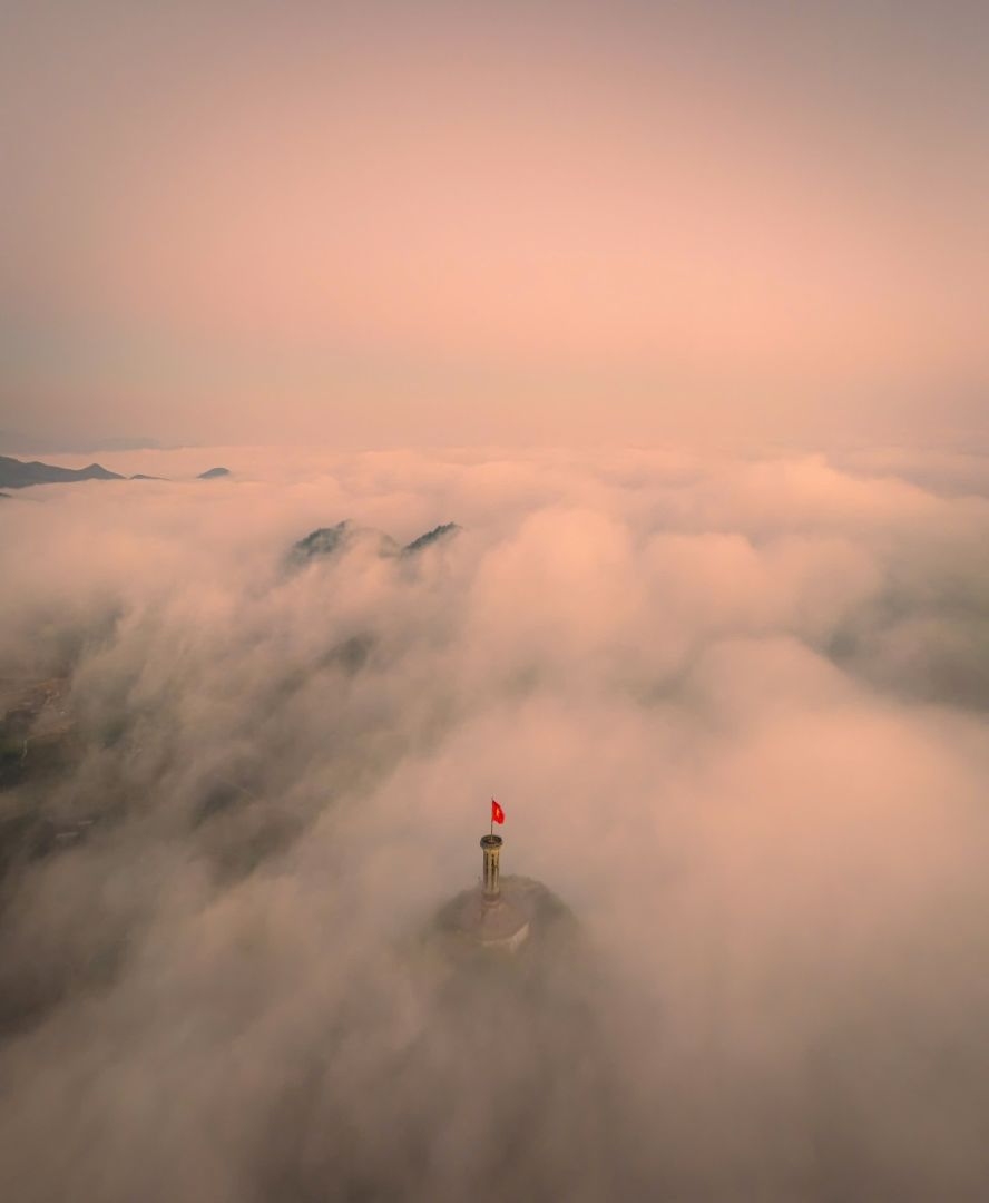 Lung Cu Flag Tower floating in a sea of clouds